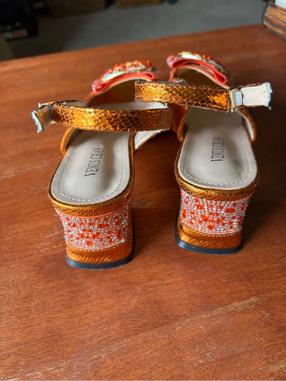 Venus Chan slingback heels w vibrant crystal-encrusted ornament on the peep toe.